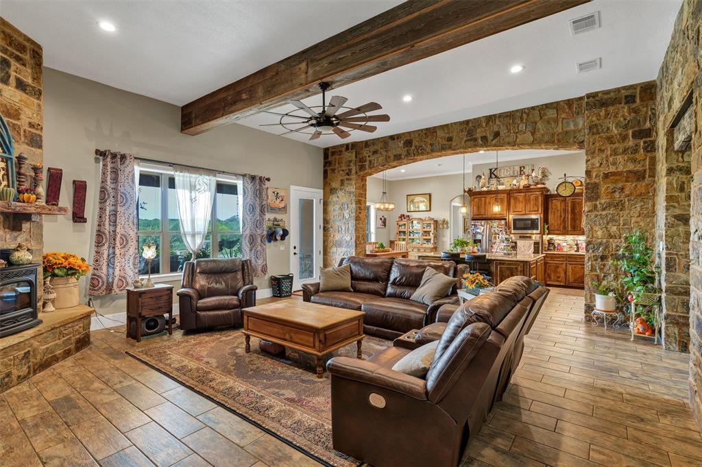 1000 Billings Road Tolar, TX 76476 - Photo 12 of 40 a living room with furniture and a chandelier