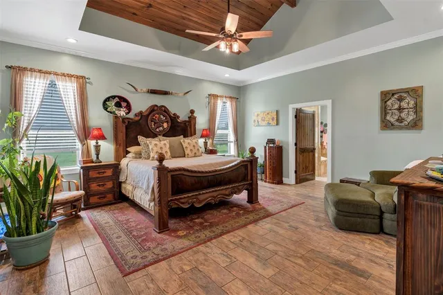 a bed room with a bed and a potted plant