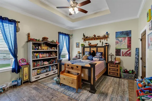 a bed room with a bed and a book shelf