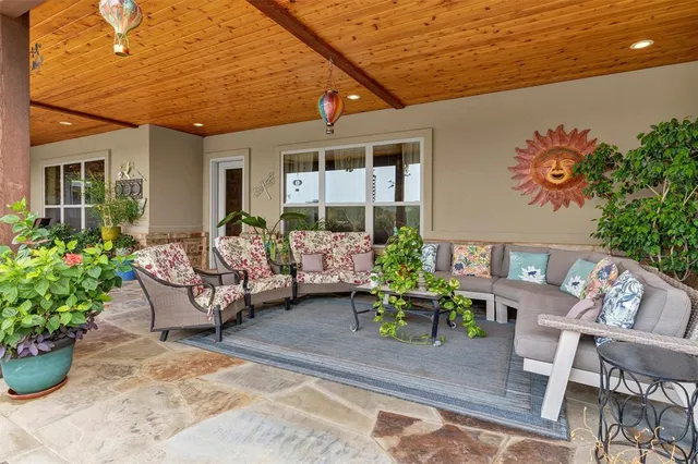 a outdoor living space with furniture and flowers