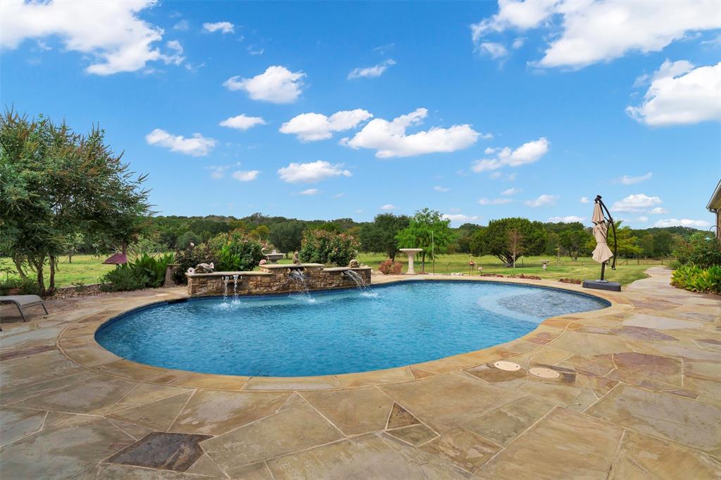 1000 Billings Road Tolar, TX 76476 - Photo 24 of 40 a view of a swimming pool and an outdoor space