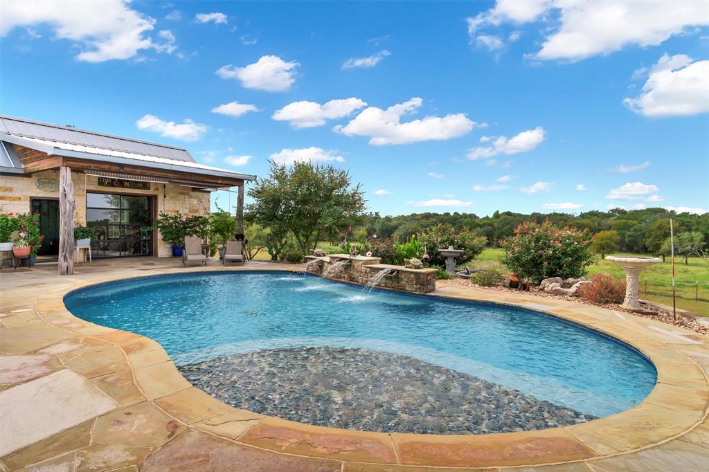 1000 Billings Road Tolar, TX 76476 - Photo 25 of 40 a view of a swimming pool with a patio