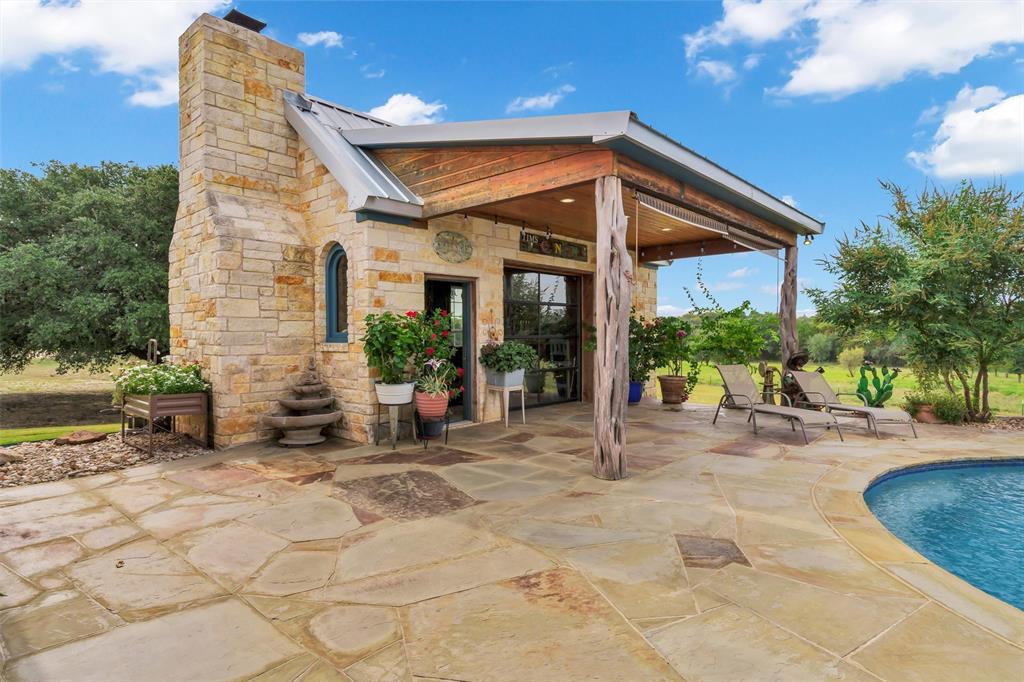 1000 Billings Road Tolar, TX 76476 - Photo 26 of 40 a view of a house with backyard porch and sitting area