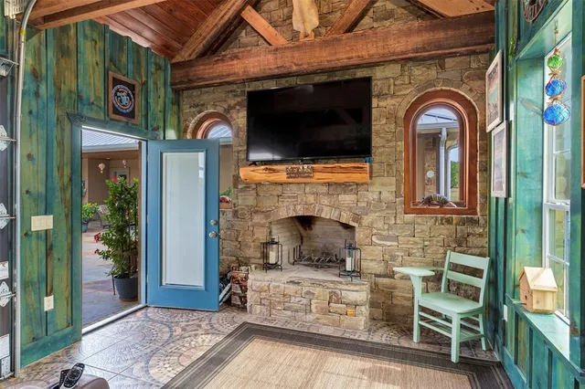 a front view of a house with barbeque grill and outdoor seating