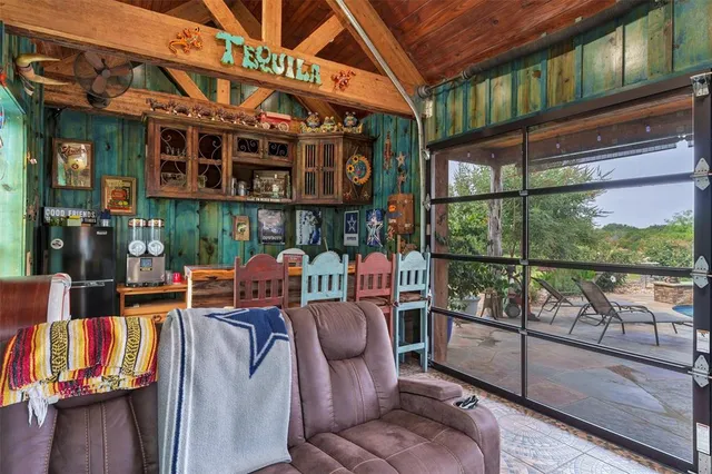 a view of a chairs and table in a patio