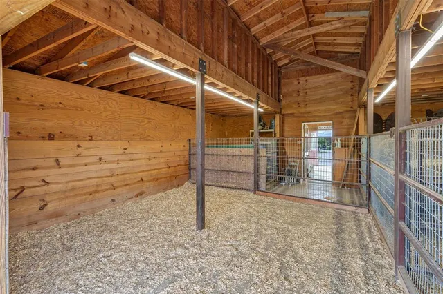 a view of a house with large space and a car park
