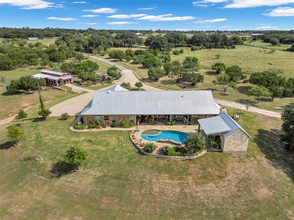 1000 Billings Road Tolar, TX 76476 - Photo 37 of 40 a view of a swimming pool and mountains in the background