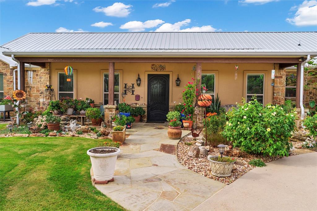 1000 Billings Road Tolar, TX 76476 - Photo 7 of 40 a view of a patio with chairs and tables