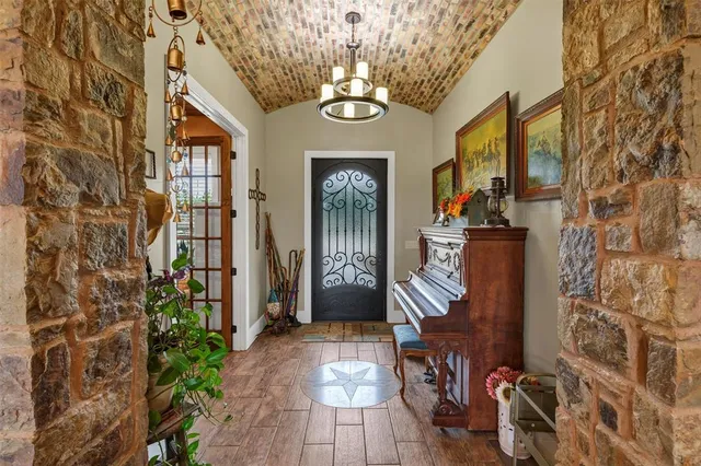 a view of an entryway with wooden floor