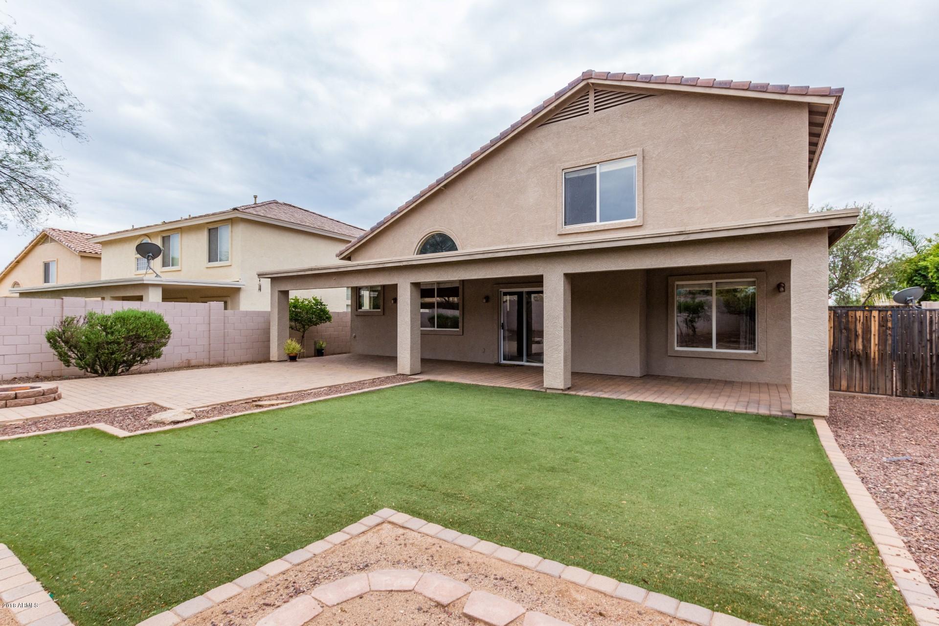 15770 West Calavar Road Surprise, AZ 85379 - Photo 20 of 21 a front view of a house with a garden
