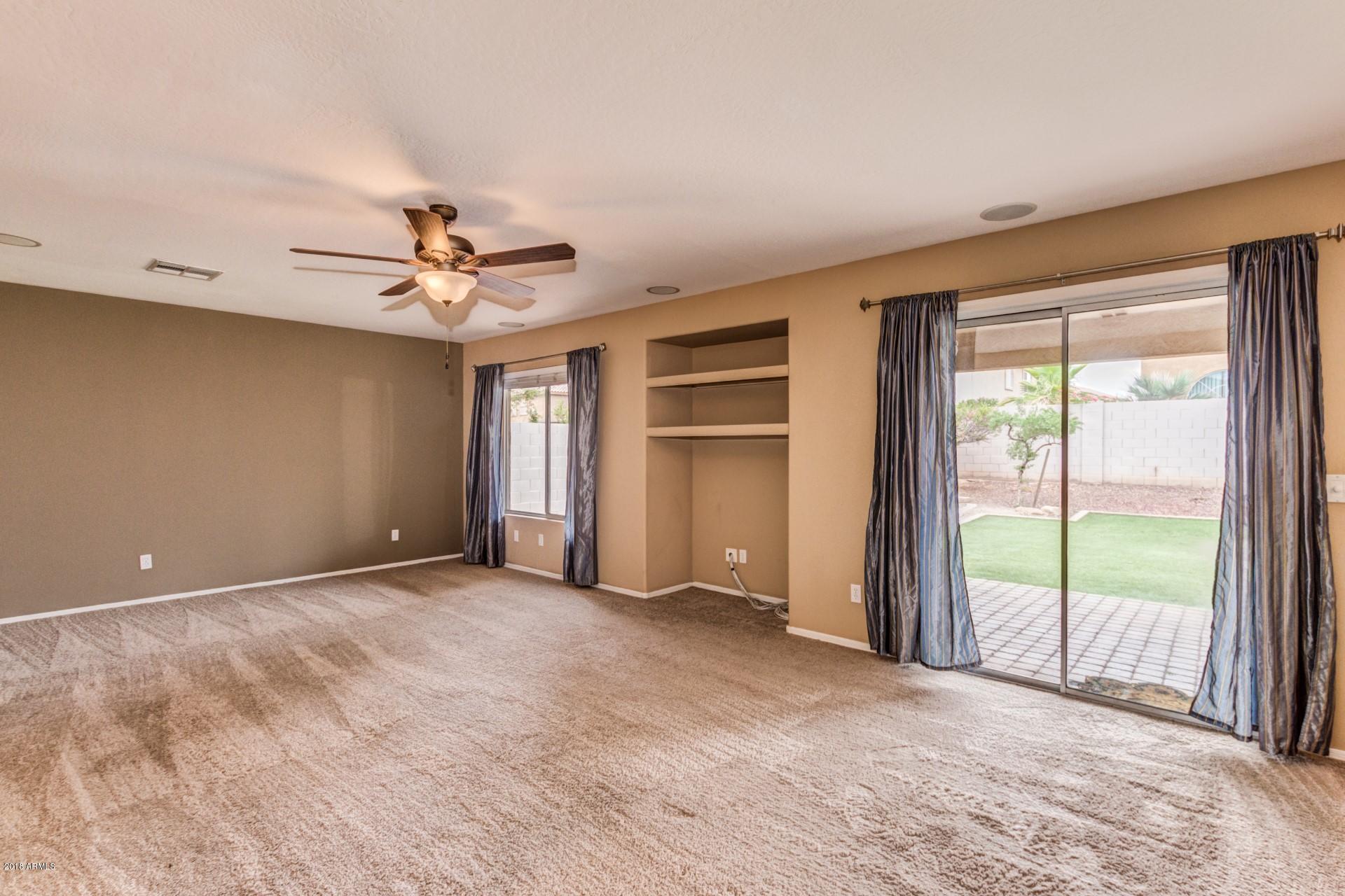 15770 West Calavar Road Surprise, AZ 85379 - Photo 4 of 21 a view of an empty room with a window