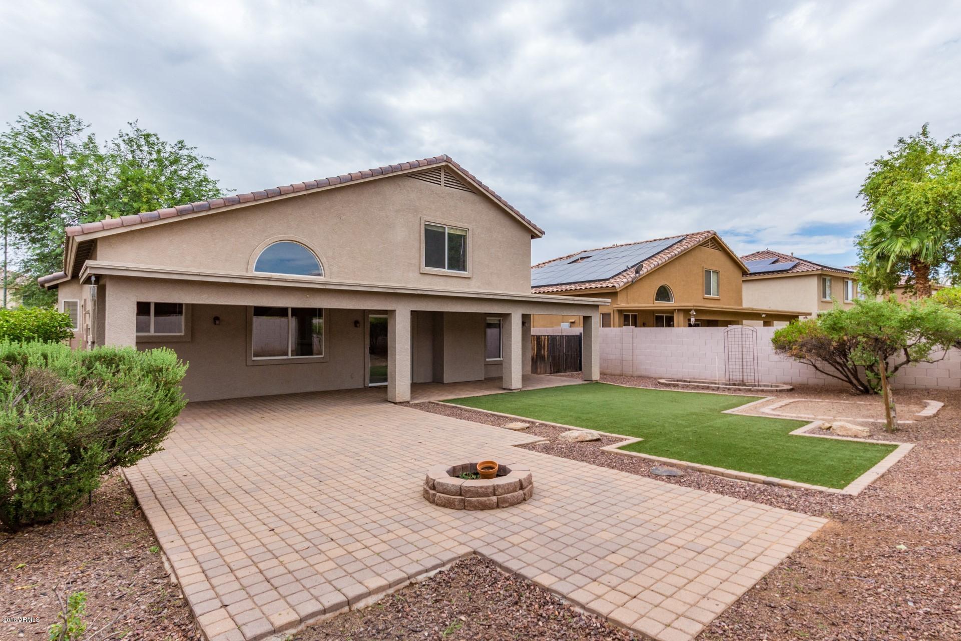 15770 West Calavar Road Surprise, AZ 85379 - Photo 5 of 21 a front view of house with yard and green space