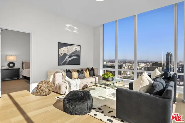 a kitchen with stainless steel appliances a sink stove and cabinets