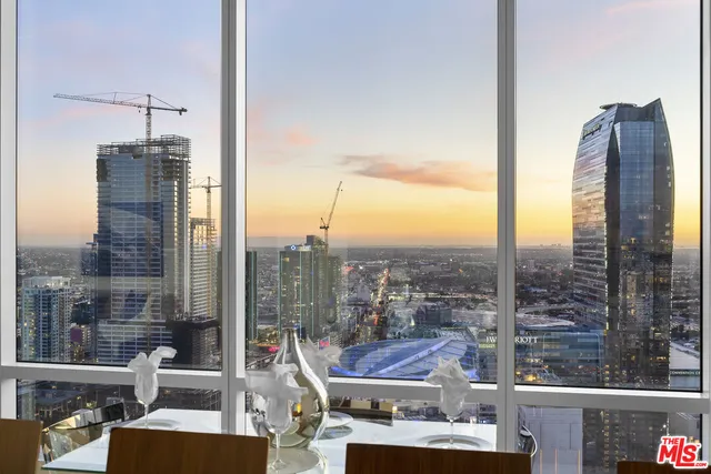 a bedroom with a bed and a night stand