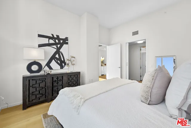 a bathroom with a sink tub vanity and a mirror