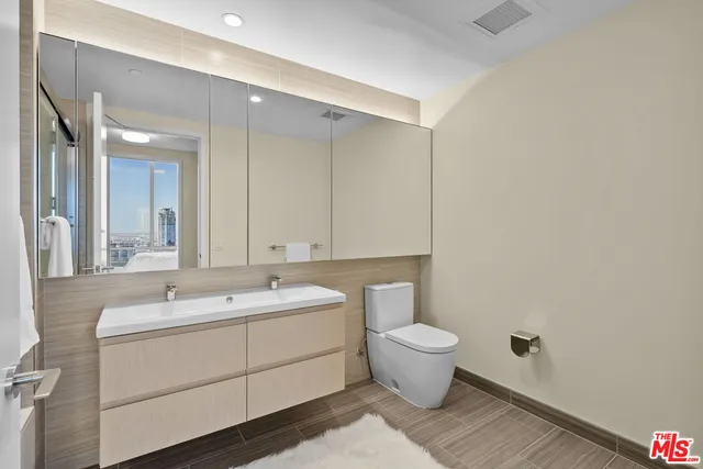 a bathroom with a shower and a bath tub