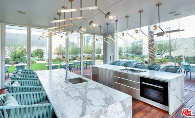 a view of a balcony with chairs and wooden floor