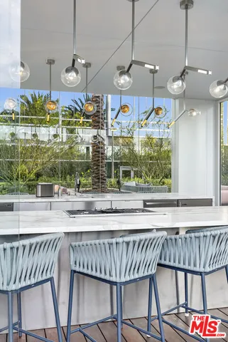 a view of a house with swimming pool and sitting area