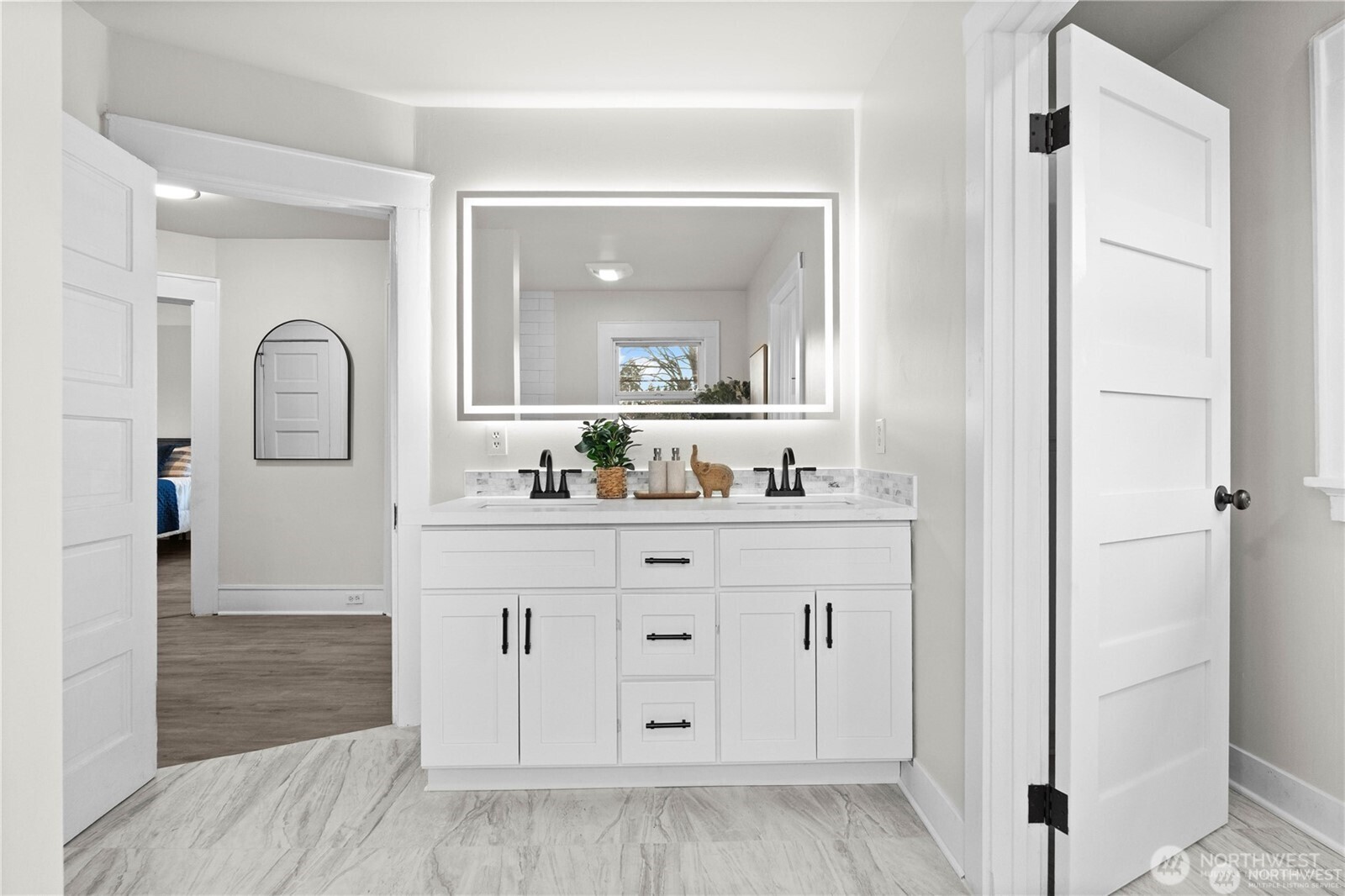 709 South Cedar Street Tacoma, WA 98405 - Photo 24 of 39 a bathroom with a double vanity sink and mirror