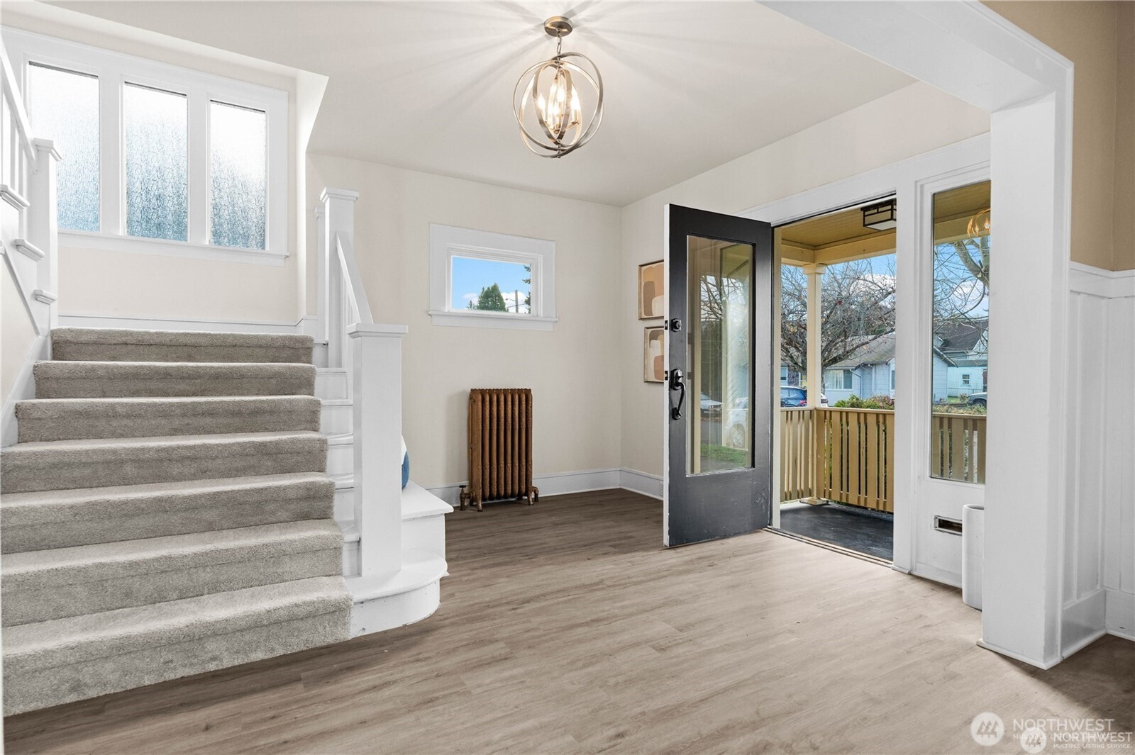 709 South Cedar Street Tacoma, WA 98405 - Photo 3 of 39 a view of an entryway with wooden floor and windows