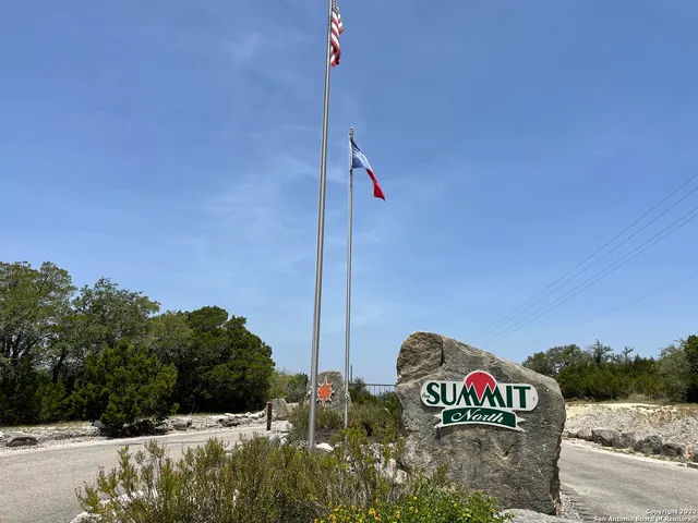 a front view of a house with sign board
