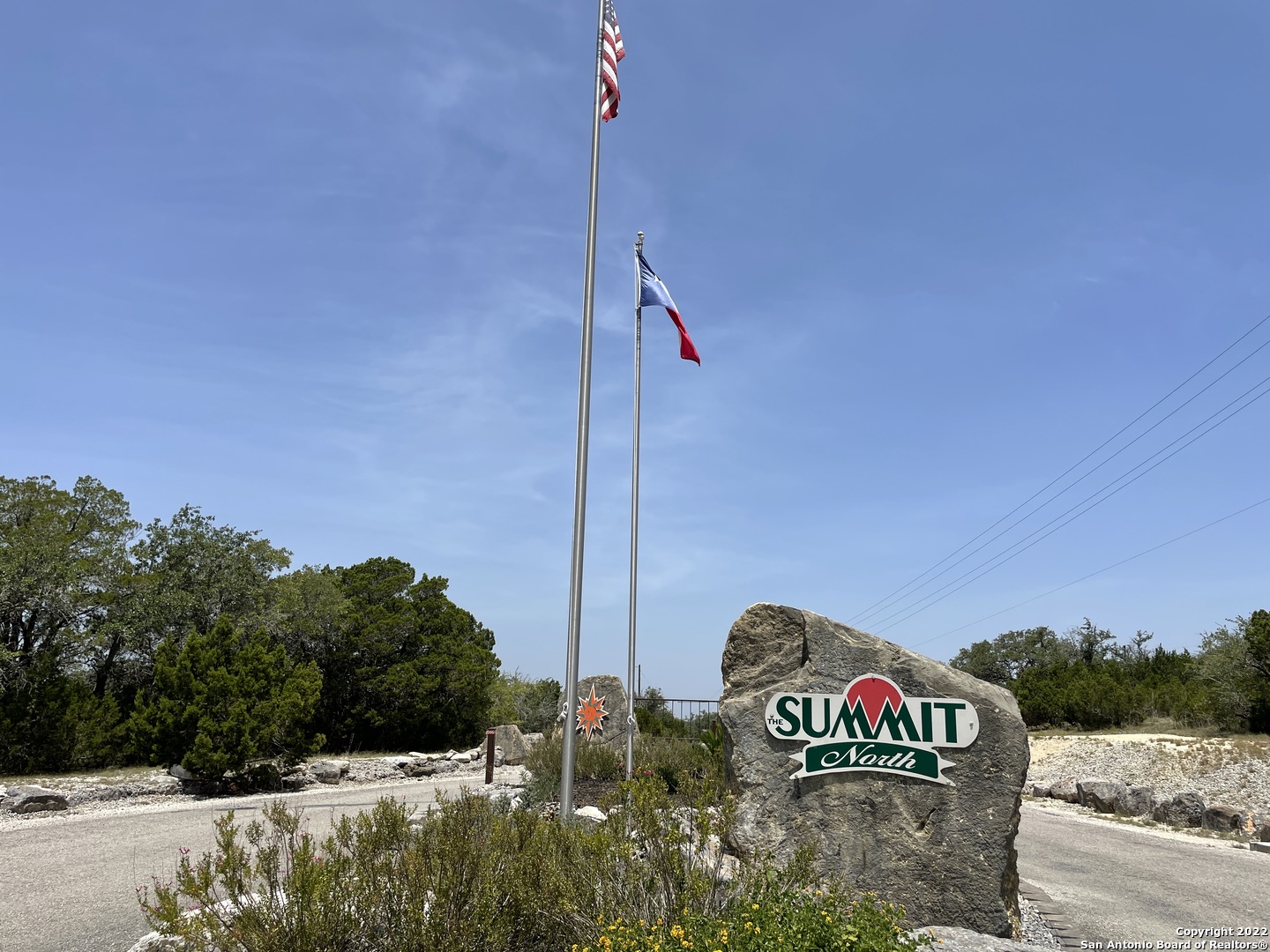 a front view of a house with sign board