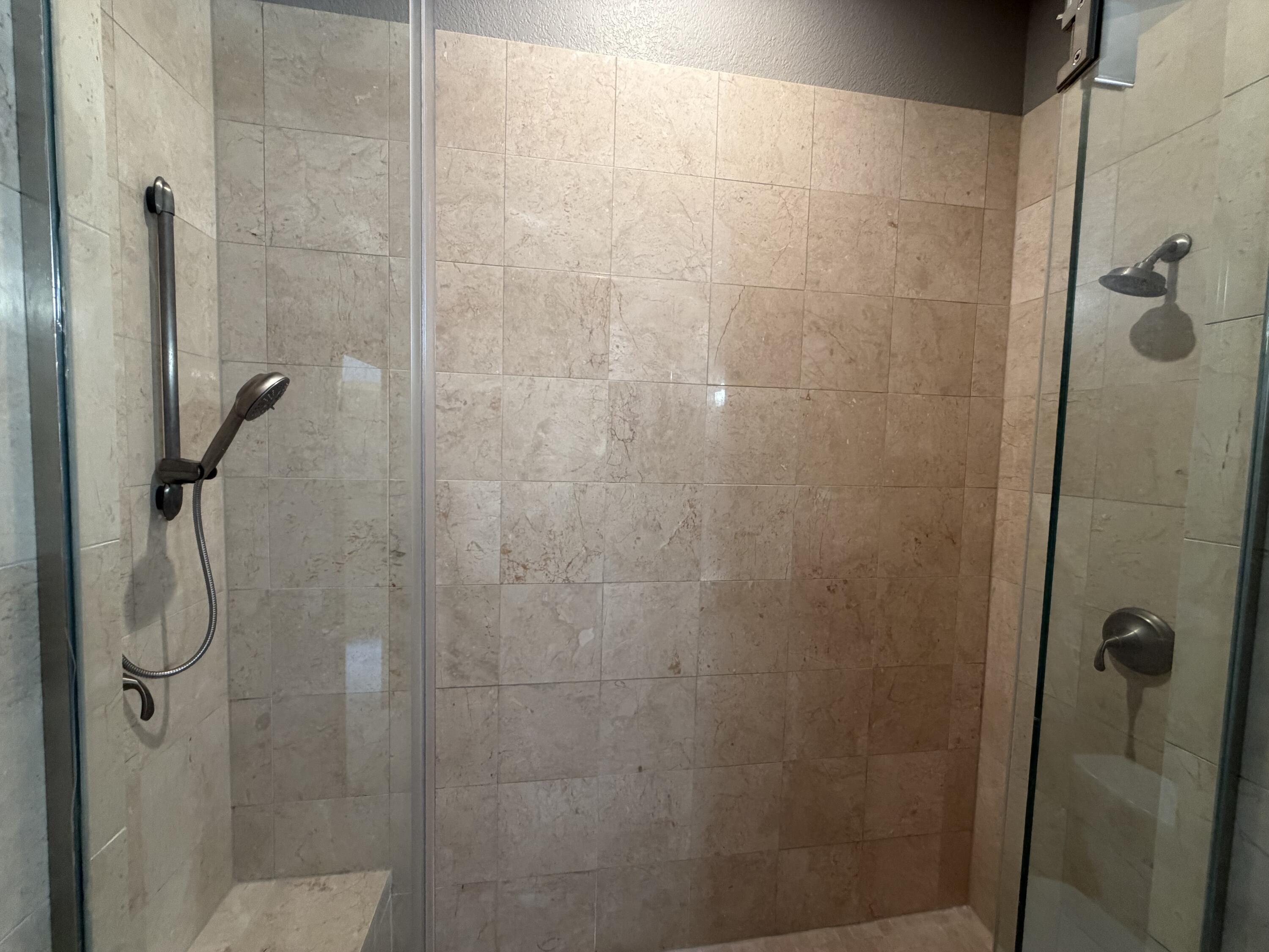 320 East Buffalo Street, Unit 803 Milwaukee, WI 53202 - Photo 25 of 31 Tiled walk-in shower