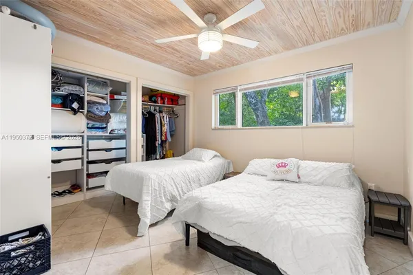 a bedroom with a bed and a cabinets