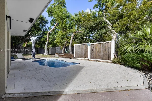 a view of a swimming pool with a patio