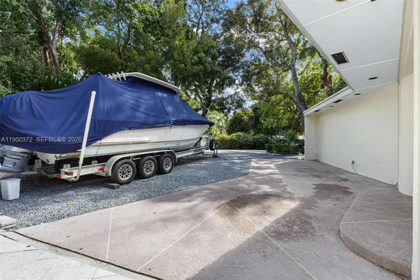 a view of a yard with car parked