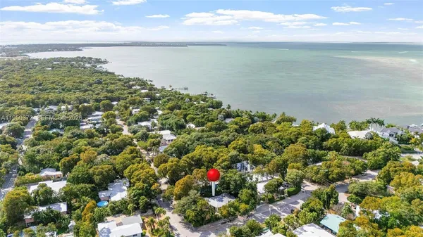 a view of a backyard with sitting area