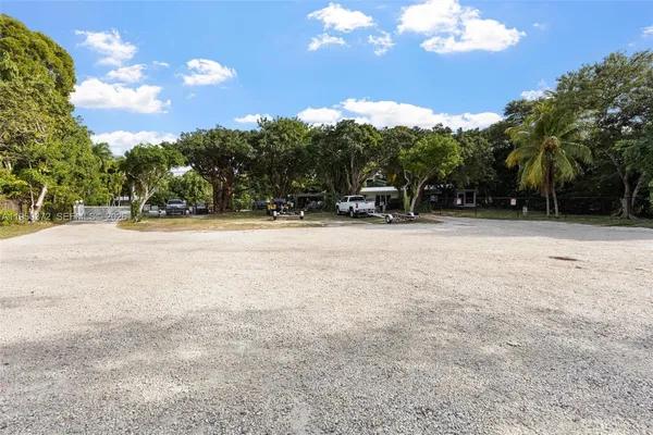a view of a yard with swimming pool