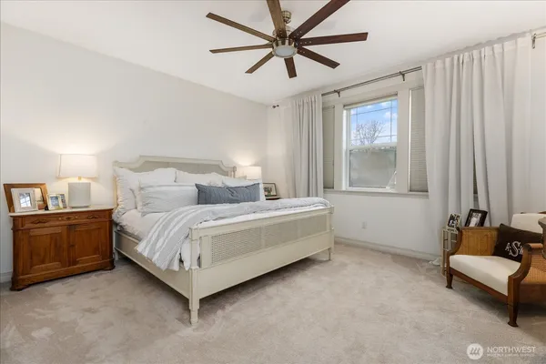 a room with a bed and a dresser