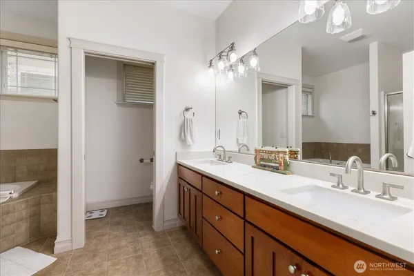a bathroom with a tub and shower