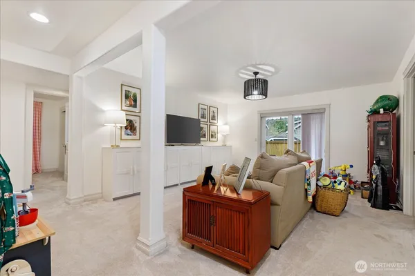 a bedroom with a bed and a television