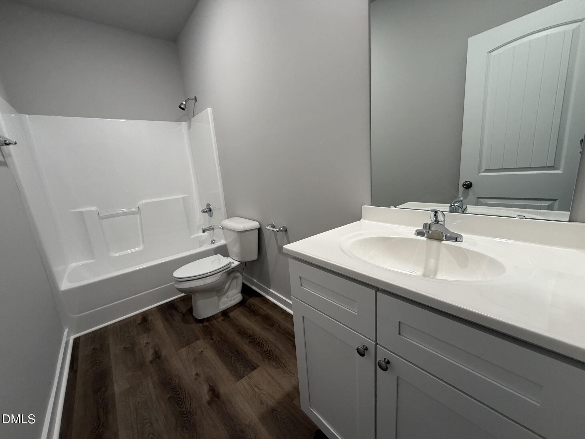 25 Jacobs Ridge Drive Four Oaks, NC 27524 - Photo 14 of 18 a bathroom with a sink toilet and shower