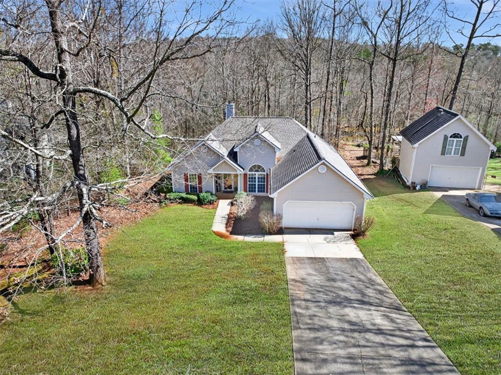 775 Sterling Place Monroe, GA 30656 - Photo 1 of 37 a front view of a house with garden