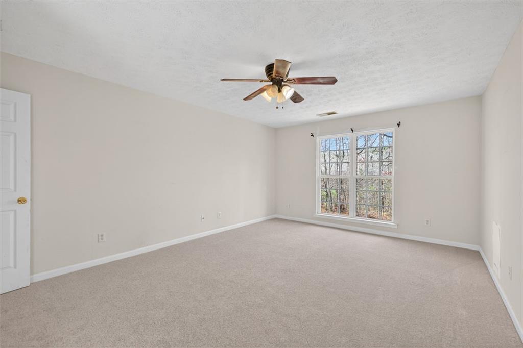 775 Sterling Place Monroe, GA 30656 - Photo 19 of 37 a view of room with a ceiling fan and window