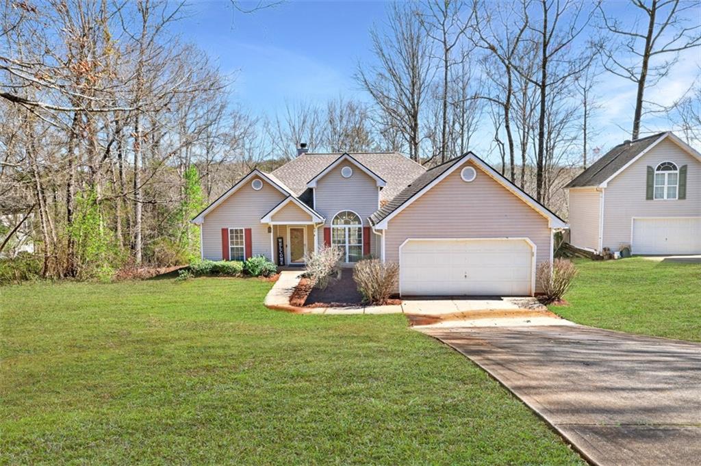 775 Sterling Place Monroe, GA 30656 - Photo 2 of 37 a view of a house with a yard and large tree