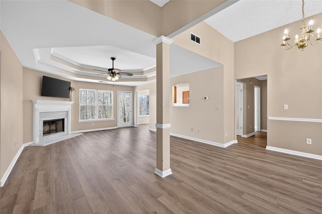 775 Sterling Place Monroe, GA 30656 - Photo 3 of 37 a view of a livingroom with wooden floor a fireplace and window