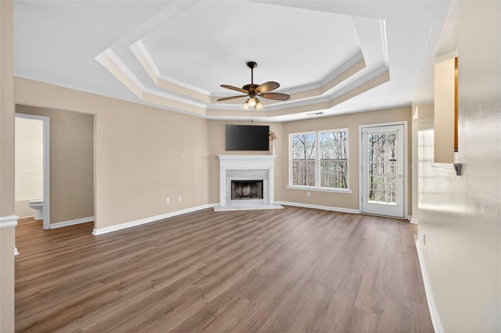 775 Sterling Place Monroe, GA 30656 - Photo 4 of 37 a view of an empty room with a window and wooden floor