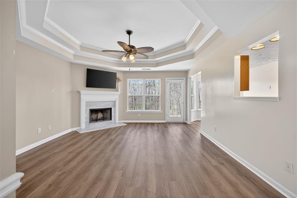 775 Sterling Place Monroe, GA 30656 - Photo 5 of 37 a view of an empty room with wooden floor and a window