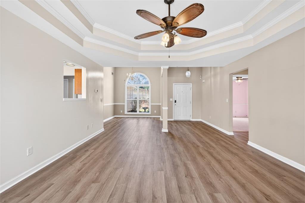 775 Sterling Place Monroe, GA 30656 - Photo 7 of 37 wooden floor in an empty room with a window