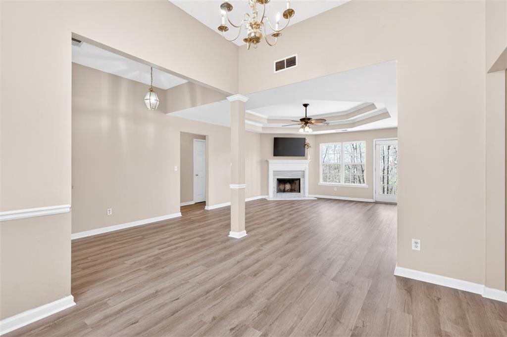 775 Sterling Place Monroe, GA 30656 - Photo 9 of 37 wooden floor in an empty room with a window