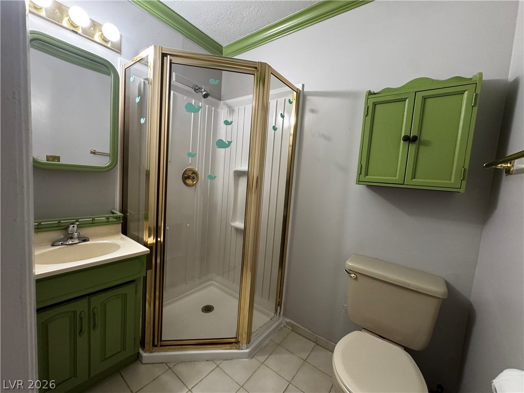 350 East Desert Inn Road, Unit C103 Las Vegas, NV 89109 - Photo 11 of 23 A compact full bathroom offers a convenient shower and a vanity with built-in storage.