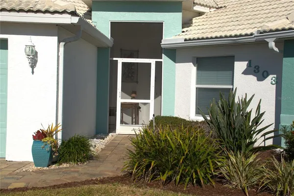 a view of a house with a potted plant