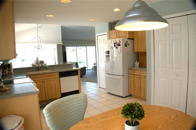 a dining room with furniture and a window