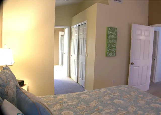 a bedroom with a bed and a table