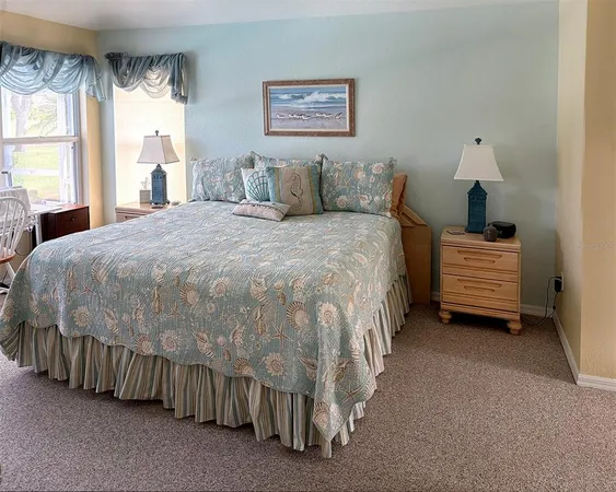a spacious bathroom with a double vanity sink a mirror and a bathtub