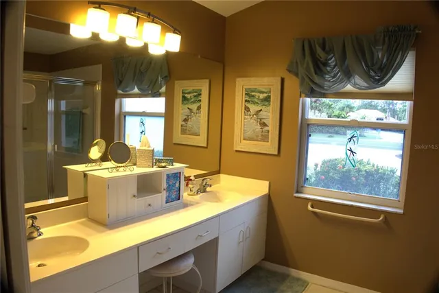 a bedroom with a bed and a lamp